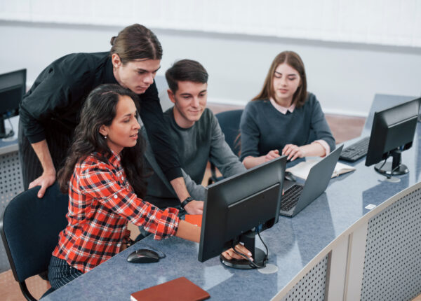 Look at this. Group of young people in casual clothes working in the modern office